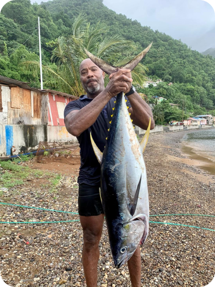 Man with a large fish he caught in Soufriere